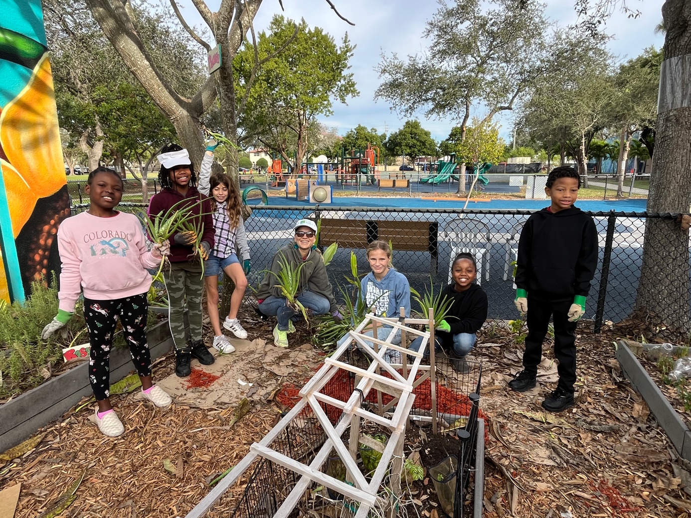 A group of kids posing for a pictureDescription automatically generated